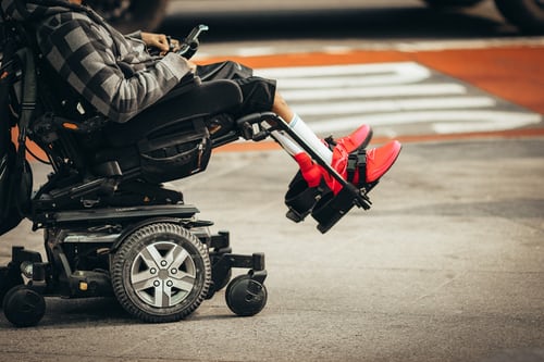child in motorized wheelchair